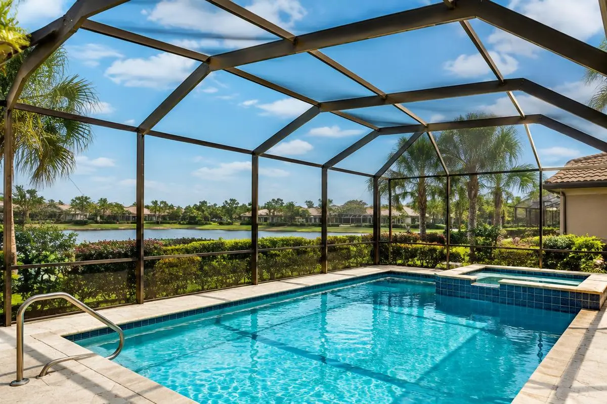 Dark-finish pool cage over a pool and spa