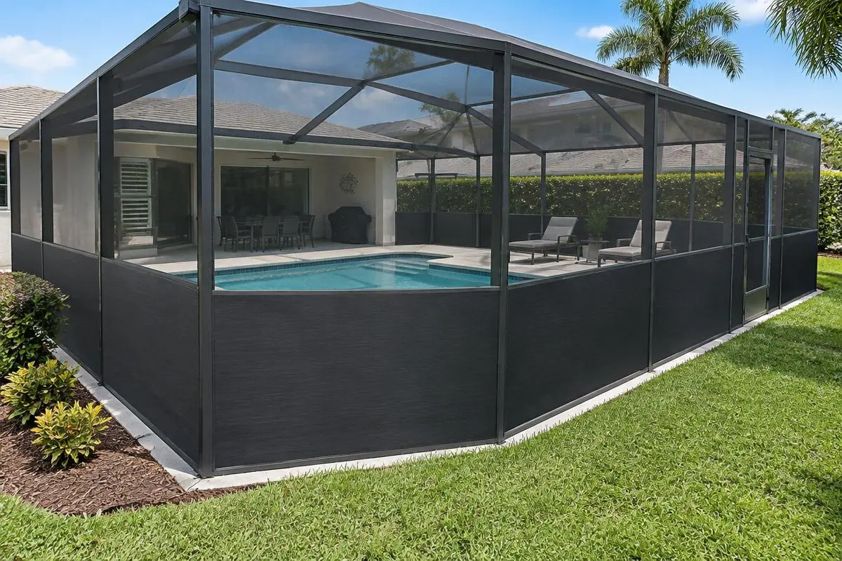 Pool enclosure with solid privacy panels along the lower walls